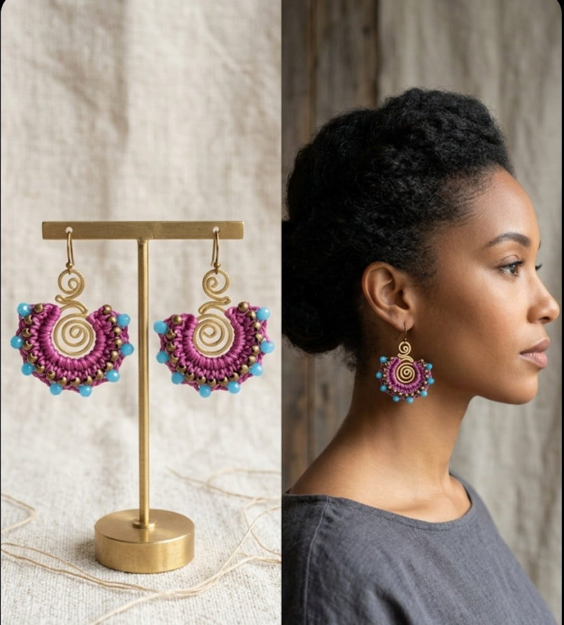 Colorful earrings on a stand next to a woman wearing them.